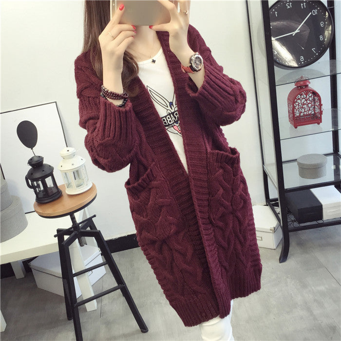 Damen Grobstrickjacke mit elegantem Zopfmuster und praktischen Taschen Stilzeits