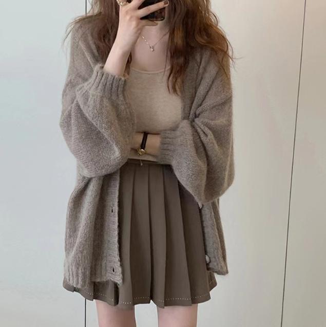 Damen Modische Strickjacke mit weiten Ärmeln und eleganten Details Stilzeits