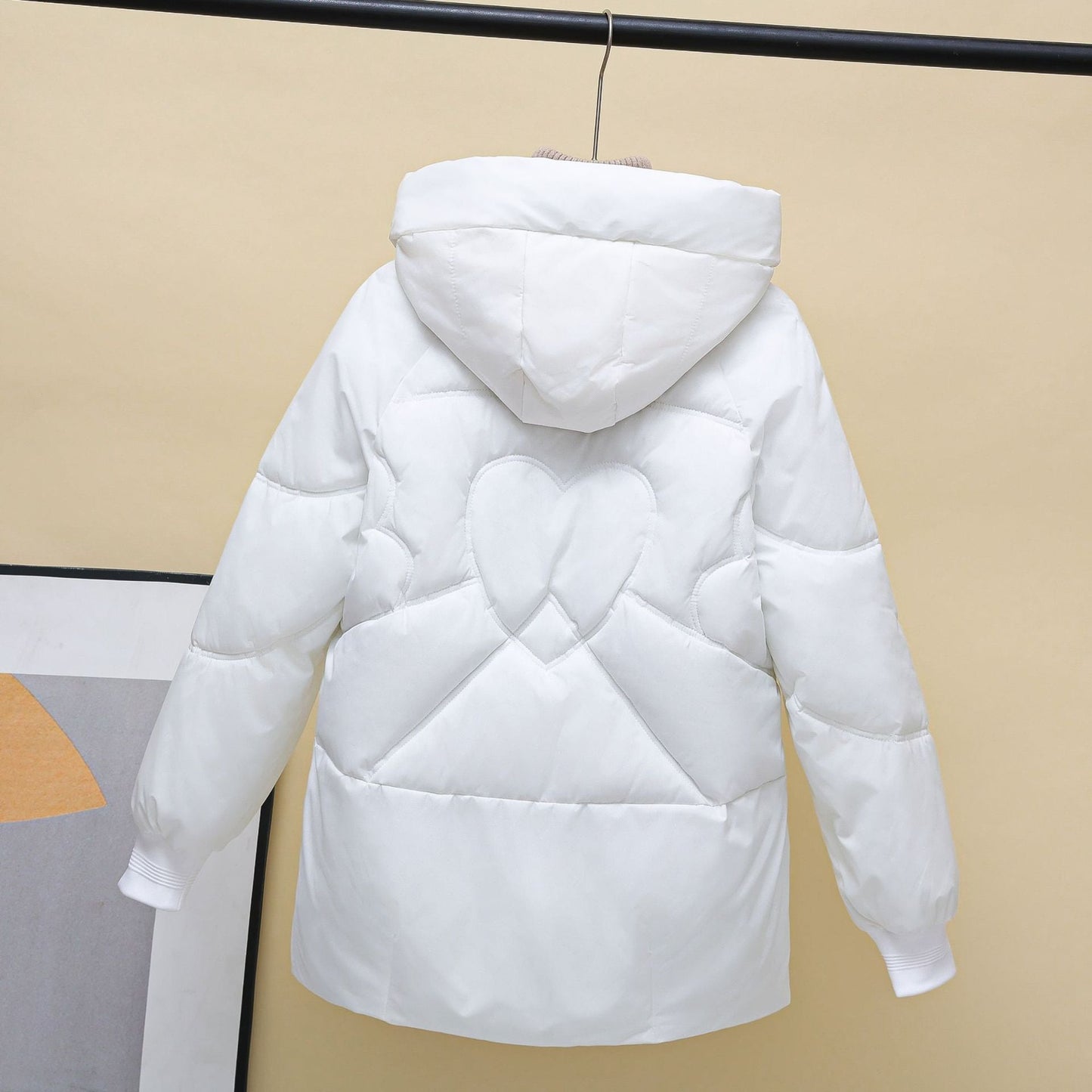 Damen gesteppte Winterjacke mit Kapuze und Herzdetails Stilzeits