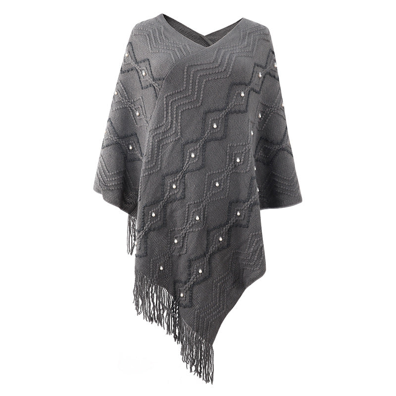 Damen eleganter Poncho mit auffälligem Strukturmuster und dekorativen Fransen Stilzeits