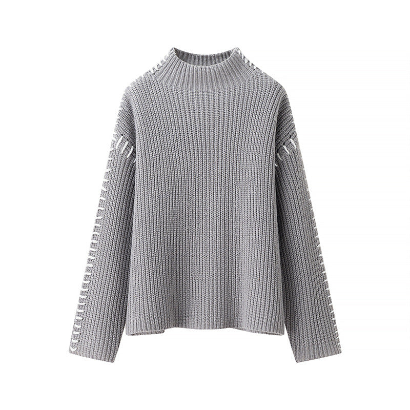Damen Grobstrickpullover mit hohem Kragen und dekorativen Details Stilzeits